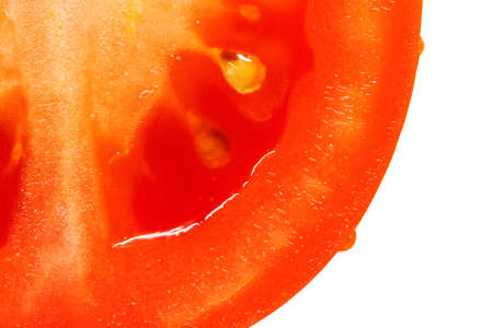 tomato macro photo, a bright colorful vegetable in the sectionの写真素材
