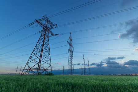 power line, outdoor on a green fieldの写真素材