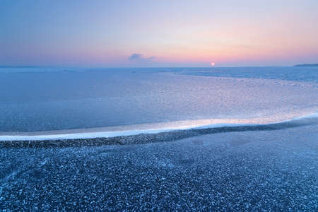 a bright winter morning landscape, soft removable warming sun rays heatの写真素材