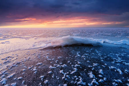 dawn on an icy lake, dawn winter morning winter landscapeの写真素材