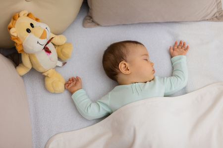 Baby Sleeping on the bedの写真素材