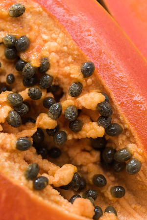 Closeup on slice of ripe orange papaya with pyrenesの写真素材