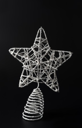 Christmas star on black background, side lightの写真素材