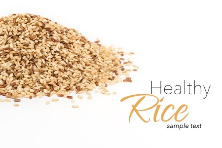 Heap of raw wholegrain rice with sample textの写真素材