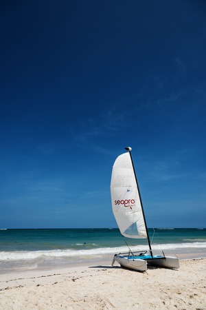 Punta Cana, Dominican Republic - circa October 2015: sail boat waits for clients on the beachのeditorial素材