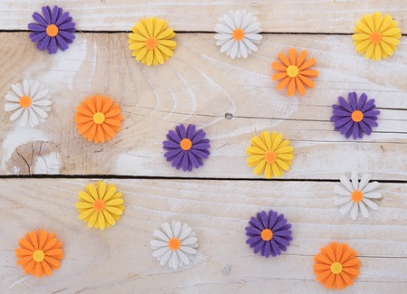 Wooden background with flowers from feltの写真素材