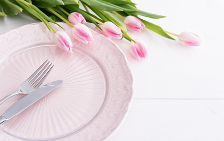 Closeup of pink tulips on pink plateの写真素材