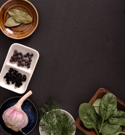 A frame of saucers and boards with vegetables and spicesの写真素材