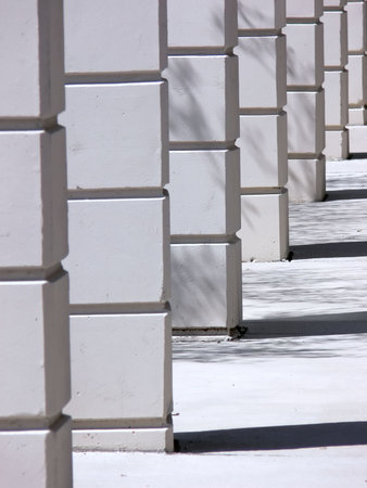 Pillars along a modern corridor.