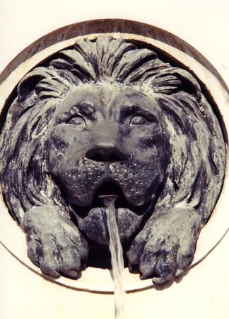 Lion, playing at being a fountain, Vienna Austria.の写真素材