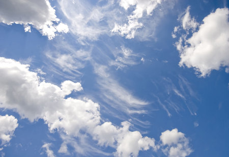A lovely patch of blue sky and fluffy white clouds.