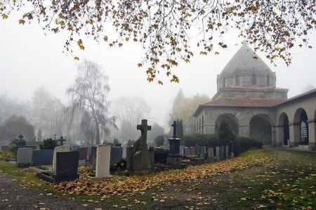A foggy churchyard and graveyard, in southern Germany.の写真素材