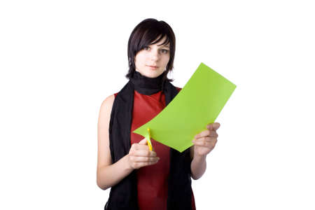 The young beautiful businesswoman at office behind work on a white backgroundの写真素材