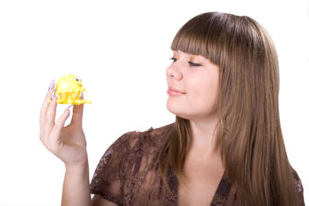 The young beautiful businesswoman at office behind work on a white backgroundの写真素材