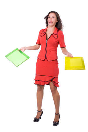 The young beautiful businesswoman at office behind work on a white backgroundの写真素材