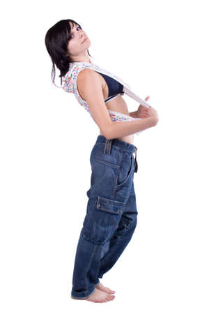 The young beautiful girl in beautiful clothes on a white backgroundの写真素材