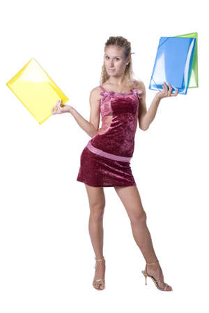 The young beautiful businesswoman at office behind work on a white backgroundの写真素材