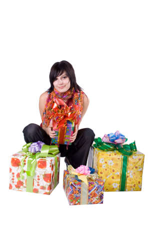 The young beautiful girl with a gift box on a white backgroundの写真素材