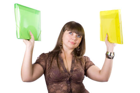 The young beautiful businesswoman at office behind work on a white backgroundの写真素材