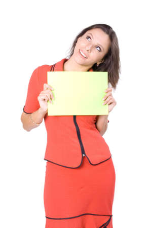The young beautiful businesswoman at office behind work on a white backgroundの写真素材