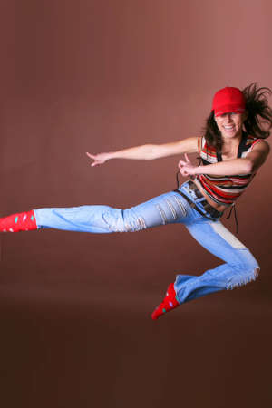 The young beautiful girl during active leisure on a color backgroundの写真素材