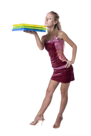 The young beautiful businesswoman at office behind work on a white backgroundの写真素材