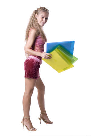 The young beautiful businesswoman at office behind work on a white backgroundの写真素材