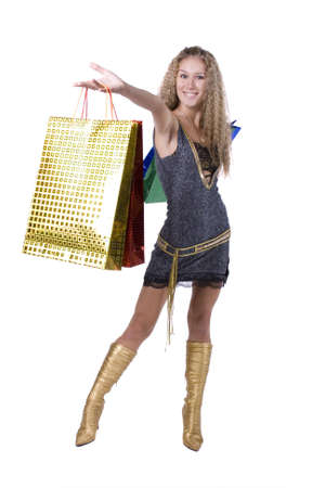 The young beautiful girl with purchases in colour packages during shopping on a white backgroundの写真素材