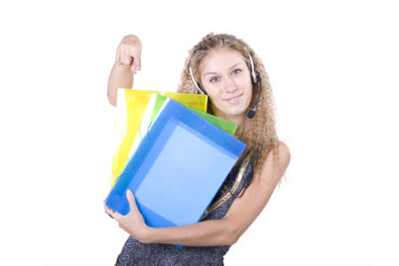The young beautiful businesswoman at office behind work on a white backgroundの写真素材