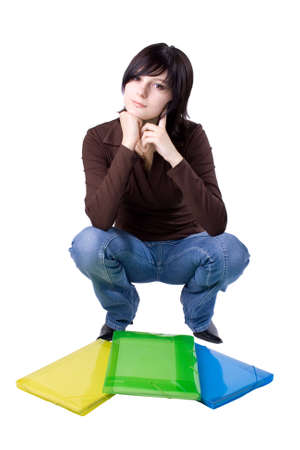 The young beautiful businesswoman at office behind work on a white backgroundの写真素材