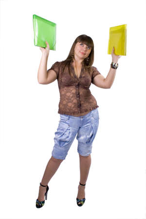 The young beautiful businesswoman at office behind work on a white backgroundの写真素材