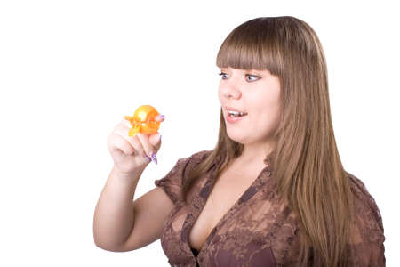 The young beautiful businesswoman at office behind work on a white backgroundの写真素材
