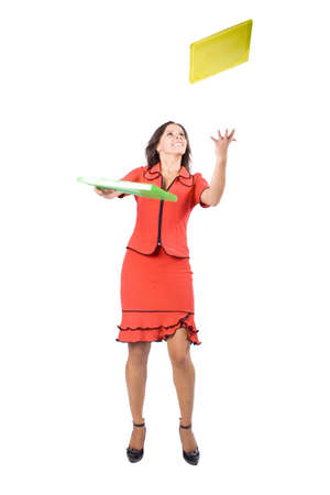 The young beautiful businesswoman at office behind work on a white backgroundの写真素材