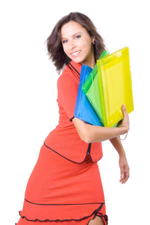 The young beautiful businesswoman at office behind work on a white backgroundの写真素材