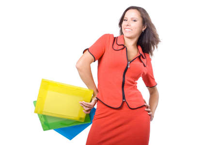 The young beautiful businesswoman at office behind work on a white backgroundの写真素材