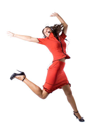 The young beautiful businesswoman at office behind work on a white backgroundの写真素材