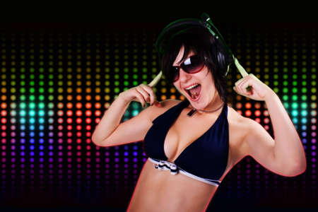 The young beautiful girl dancing in a night clubの写真素材