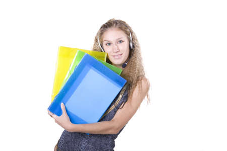 The young beautiful businesswoman at office behind work on a white backgroundの写真素材