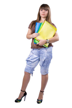 The young beautiful businesswoman at office behind work on a white backgroundの写真素材