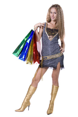 The young beautiful girl with purchases in color packages during shopping on a white backgroundの写真素材