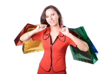 The young beautiful girl with purchases in color packages during shopping on a white backgroundの写真素材