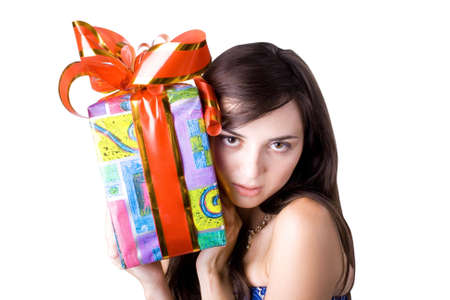 The young beautiful girl with a gift box on a white backgroundの写真素材