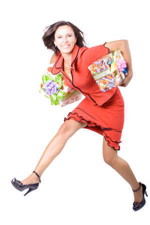 The young beautiful businesswoman at office behind work on a white backgroundの写真素材