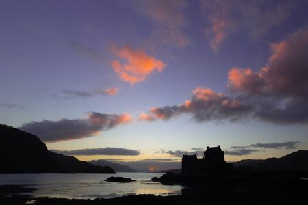 Elean donan castle sunset colorful sky orange purpleの写真素材