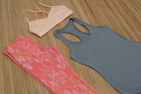 Fitness yoga capri leggings, sports bra, and white tank top flat-lay, sports bra, and grey tank top flat-layの写真素材