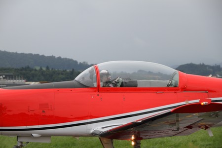 EMMEN - JULY 24: Pilot of a historic Piaggio P 149D  presents his vintage plane to the audience at the Airshow "100 years Swiss aviation" July 24, 2010 in Emmen, Switzerland.のeditorial素材