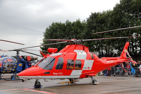 EMMEN - JULY 24: Swiss Air rescue REGA presents its modern rescue helicopter AgustaWestland Da Vinci at the Airshow "100 years Swiss aviation" July 24, 2010 in Emmen, Switzerland.のeditorial素材