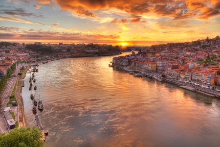 Panorama old city Porto at river Duoro,with Port transporting boats at sunset,  Oporto, Portugalの写真素材