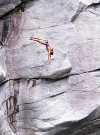 LOCARNO - JULY 23: Cliff diving athletes compete in the WHDF European Championship 2011 with dives from up to 20m high July 23, 2011 in Locarno, Switzerland. The Venue was Ponte Brolla at Vallemaggia.のeditorial素材