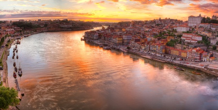 Panorama old city Porto at river Duoro,with Port transporting boats at sunset,  Oporto, Portugalの写真素材